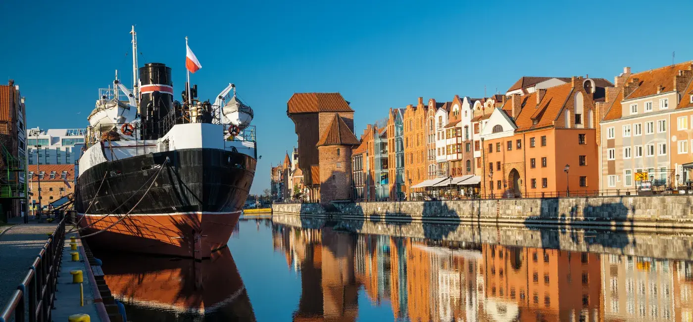 ship docked nearby view of Krakow, Poland